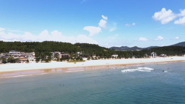 Scenic beach with people enjoying water activities
