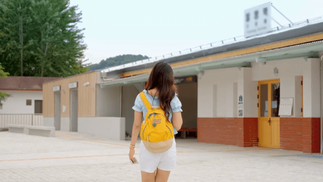 Woman checking the time and going to catch the train