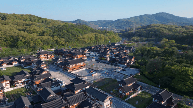 Traditional hanok village surrounded by mountains