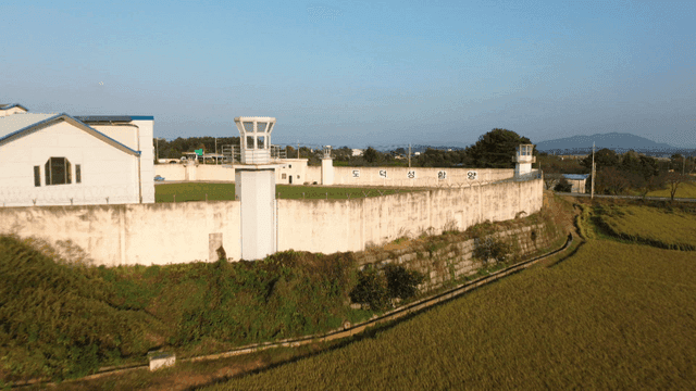 Rural prison surrounded by fields