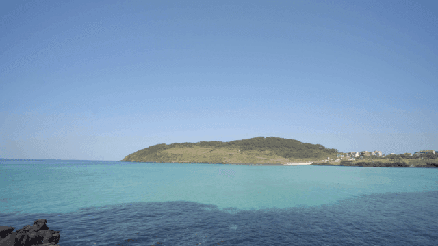 Tranquil coastal landscape with clear seas