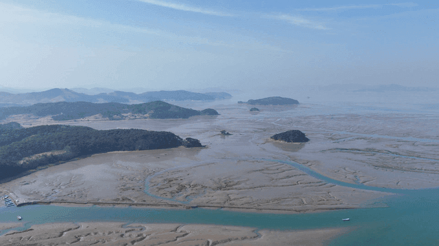 Expansive tidal flats with distant islands