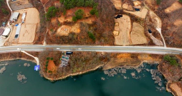 Aerial View of Scenic Roadside by a Lake