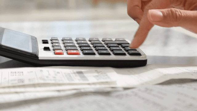 Calculating expenses with a calculator