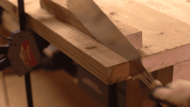 Wood being cut with a saw in a workshop