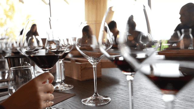 A group enjoying wine at a restaurant