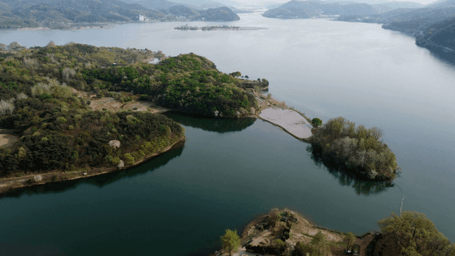 Aerial view of lake with forested island
