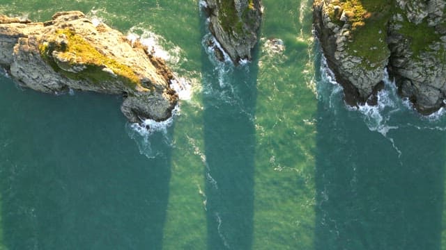 Rocky island surrounded by ocean waves