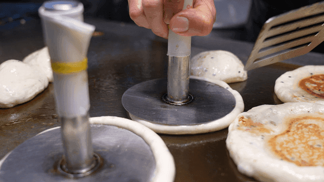 Hotteok cooked on hot iron plate
