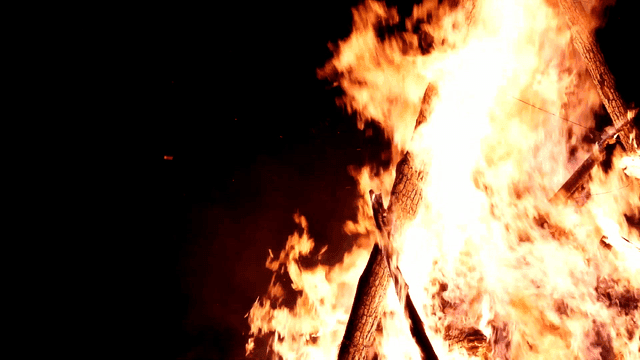 Large bonfire burning brightly at night