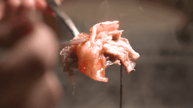 Kimchi and meat on a steaming spoon