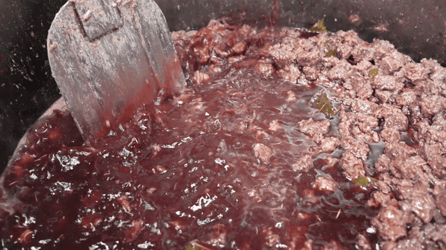 Wine poured into stew pot