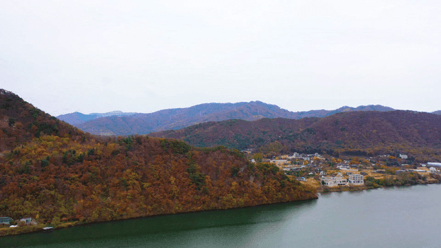 Calm lake next to village