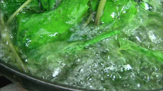 Blanching spinach in boiling water