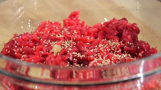 Seasoned beef tartare with sesame seeds and minced garlic