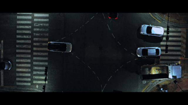 Cars at a intersection at night