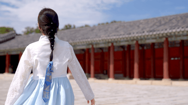 Woman in hanbok at a traditional palace