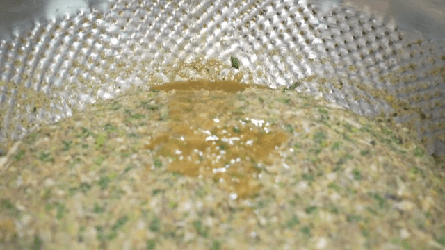 Adding sauce to dumpling filling