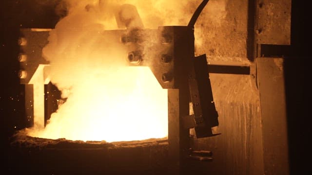 Molten metal being poured in a foundry