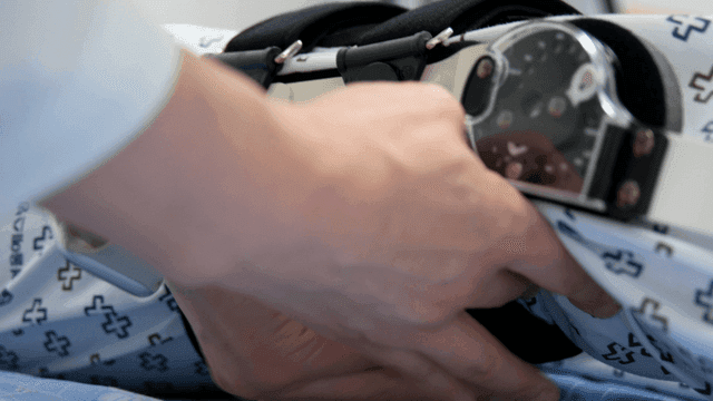 Adjusting a medical brace on a patient