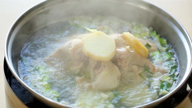 Ginseng chicken soup boiling in a pot