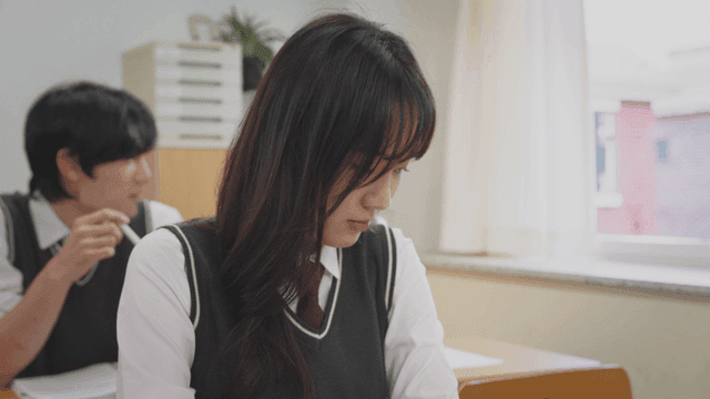 Smiling boy talking to a distressed girl