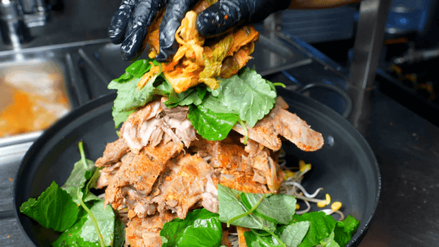 Pork backbone stew being prepared in kitchen