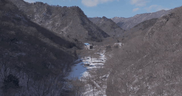 Snow-covered valleys and distant mountains