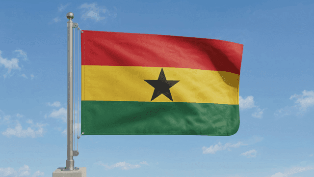Flag of Republic of Ghana fluttering against clear sky