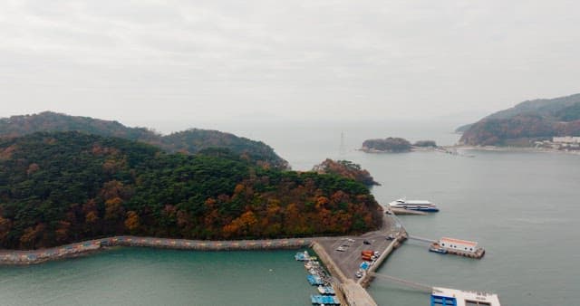 Autumn-Colored Forests and Coastal Villages