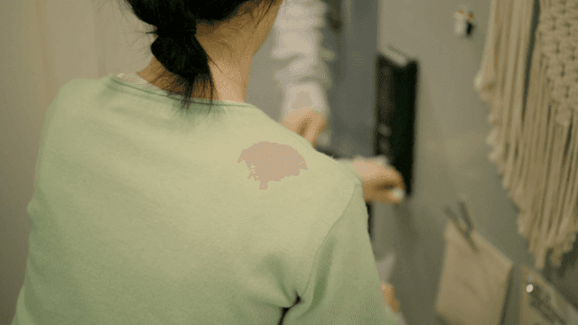 Scene where woman opens door and receives delivery.