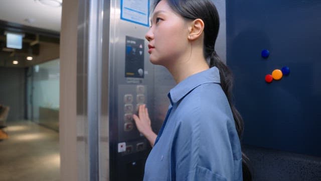 Woman riding an elevator