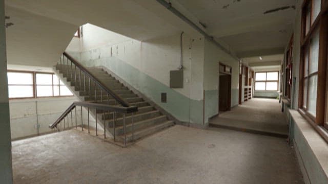 Students in an Abandoned School Hallway