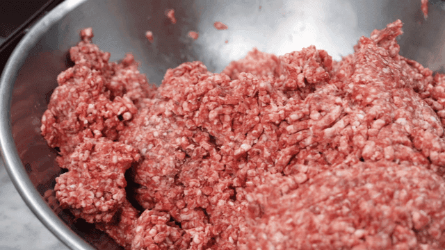 Ground meat in a metal bowl