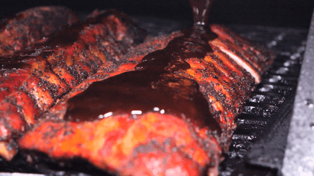 Dish of applying sauce to barbecue ribs
