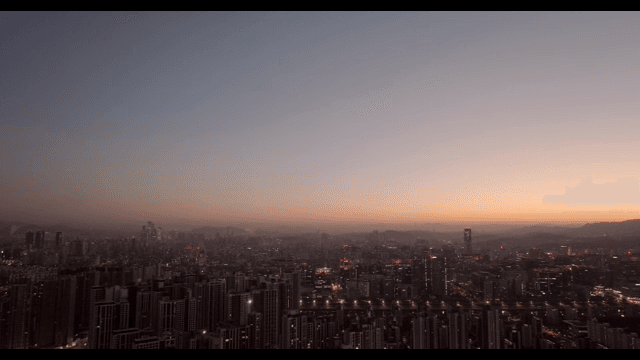 City skyline at dusk with a colorful sky