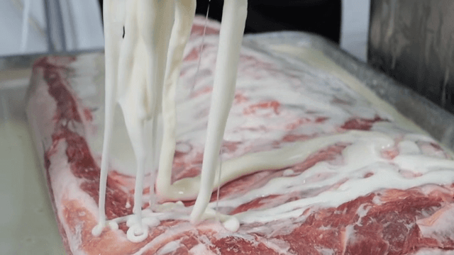 Pouring sweet potato starch over raw meat