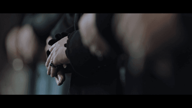 Hands clasped together in a solemn moment