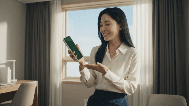 Woman demonstrating smartphone
