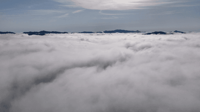 Clouds covering mountain peaks