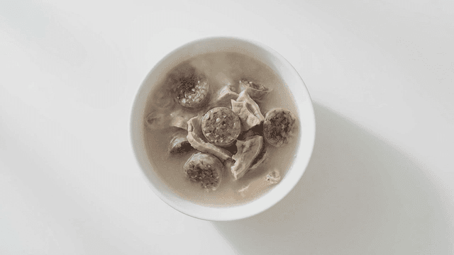Korean blood sausage soup in a white bowl