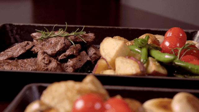 Grilled steak with vegetables on a tray