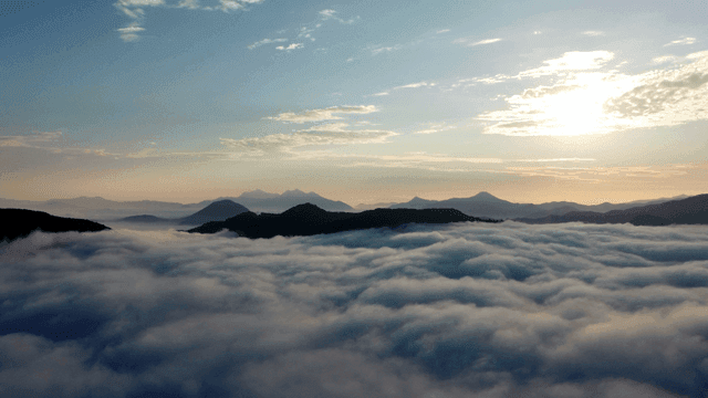 Mountains covered in clouds at sunrise