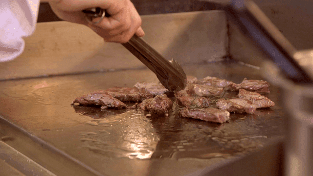 Steak grilled on hot iron plate