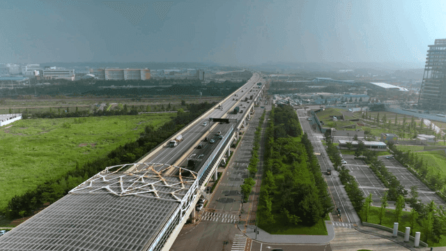 Highway cutting across landscape of green plains
