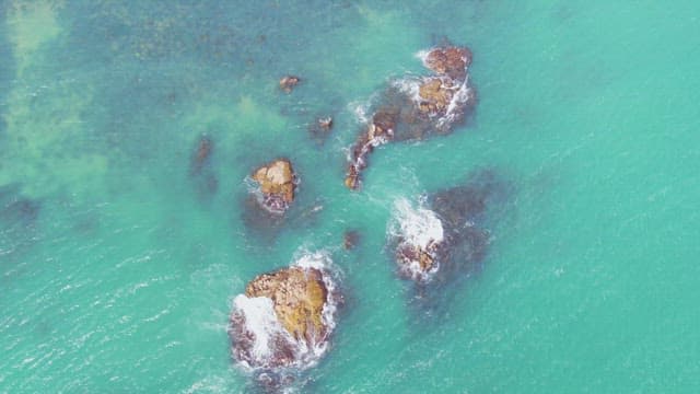 Waves crashing on rocky sea formations