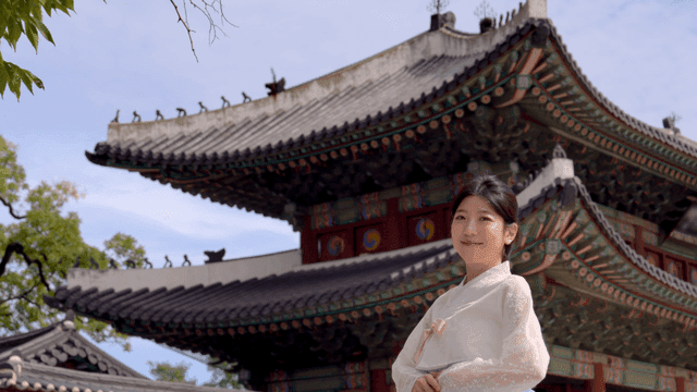 Traditional Korean architecture and woman in hanbok