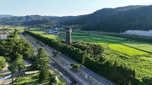 Rural train station surrounded by fields