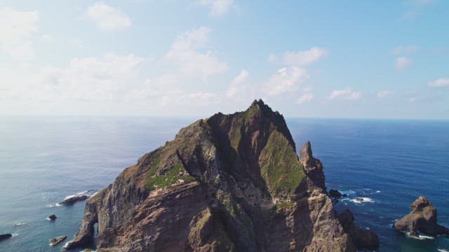 Rocky island surrounded by blue ocean