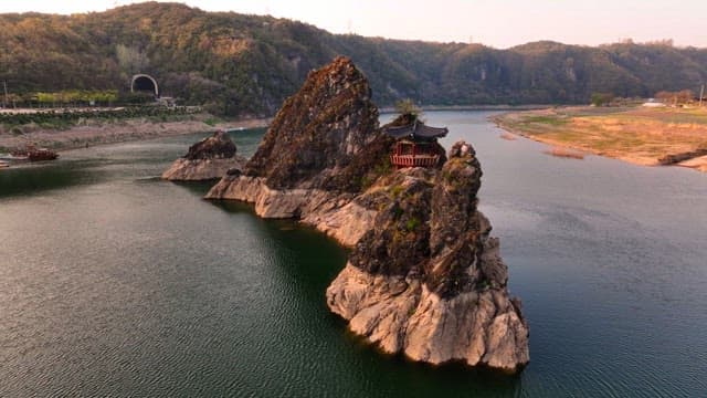 Traditional pavilion on a rocky island